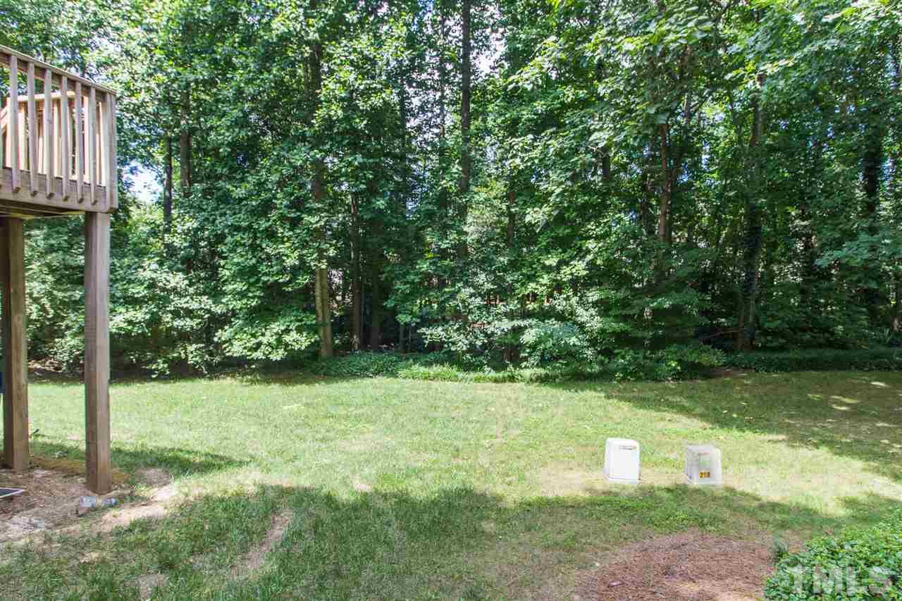 4451 Antique Lane Raleigh, NC 27616 - Photo 24 of 24 a view of a backyard with large trees