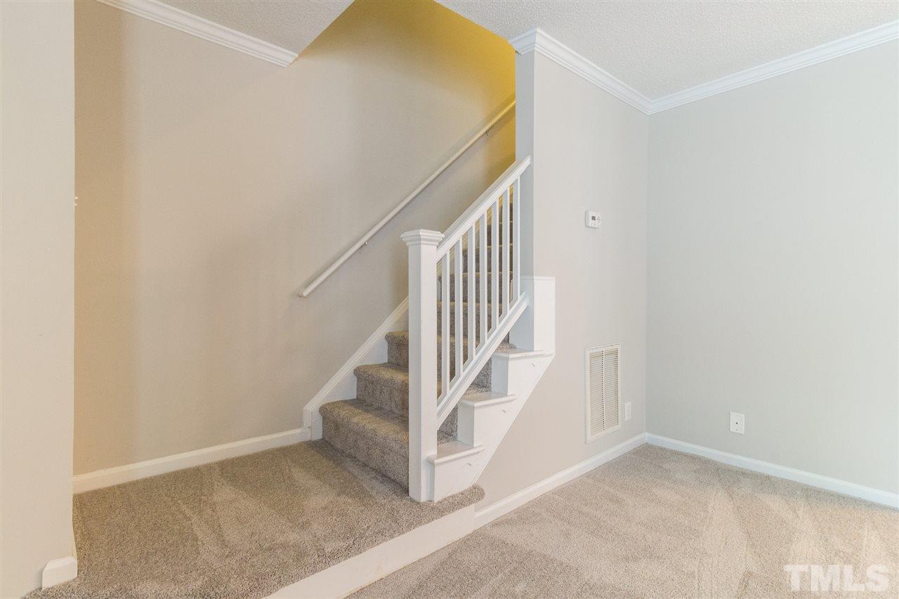 4451 Antique Lane Raleigh, NC 27616 - Photo 5 of 24 an entryway in a room with stairs