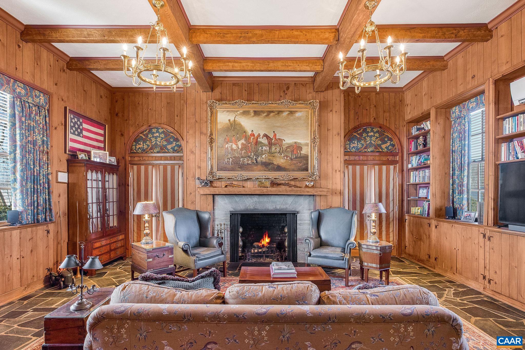 2328 Liberty Corner Road Esmont, VA 22937 - Photo 16 of 75 a living room with furniture a fireplace and a chandelier