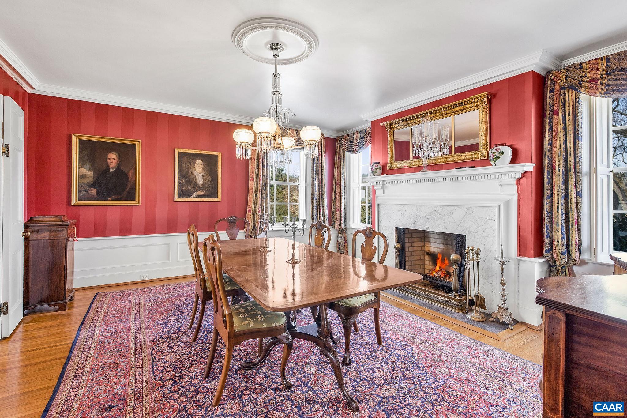 2328 Liberty Corner Road Esmont, VA 22937 - Photo 20 of 75 a dining room with furniture a chandelier and wooden floor
