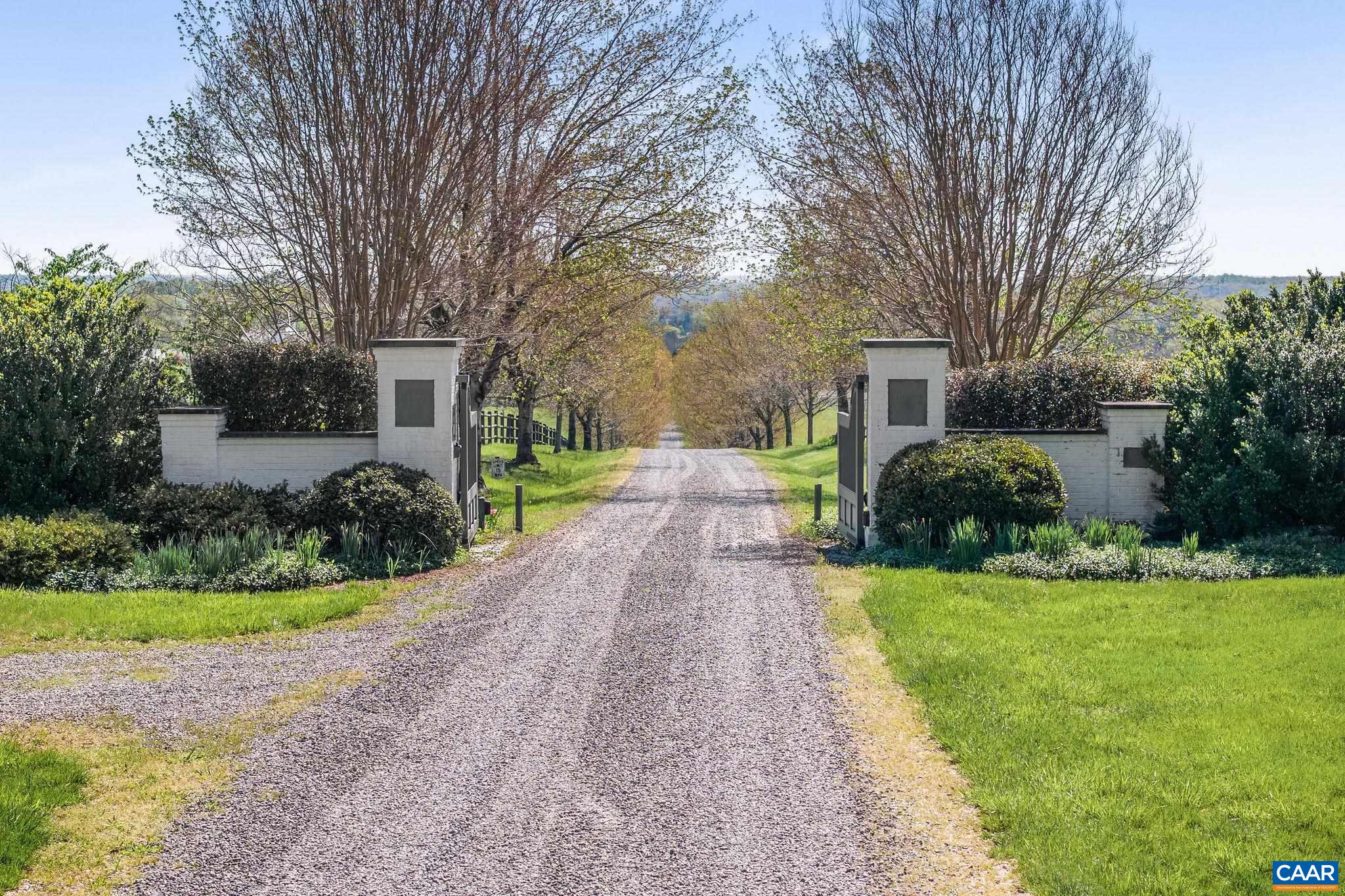 2328 Liberty Corner Road Esmont, VA 22937 - Photo 2 of 75 a front view of a house with garden and trees
