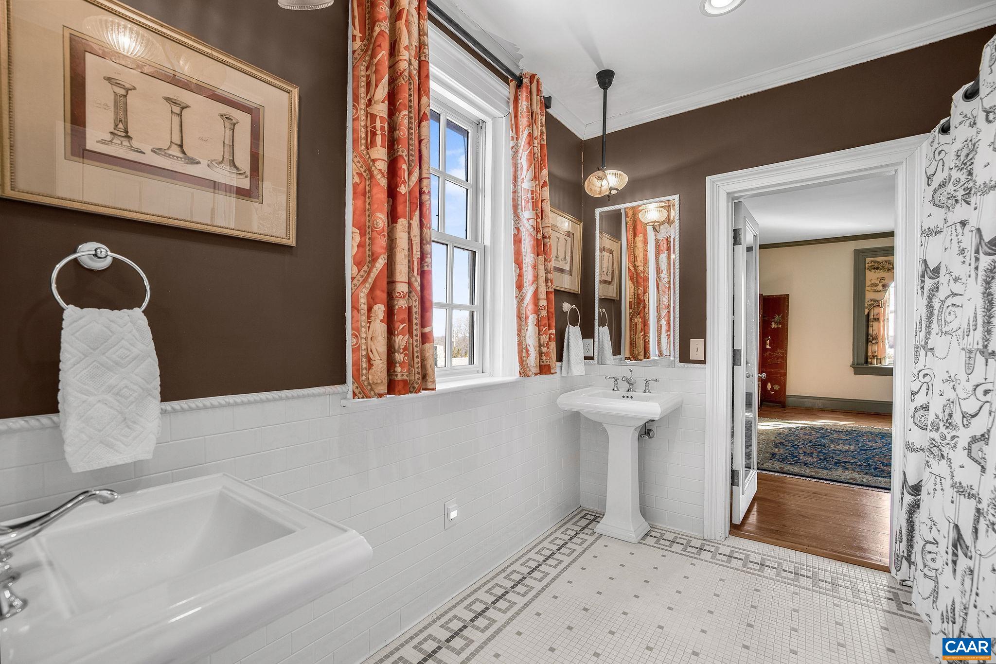 2328 Liberty Corner Road Esmont, VA 22937 - Photo 32 of 75 a bathroom with a sink a mirror and a shower