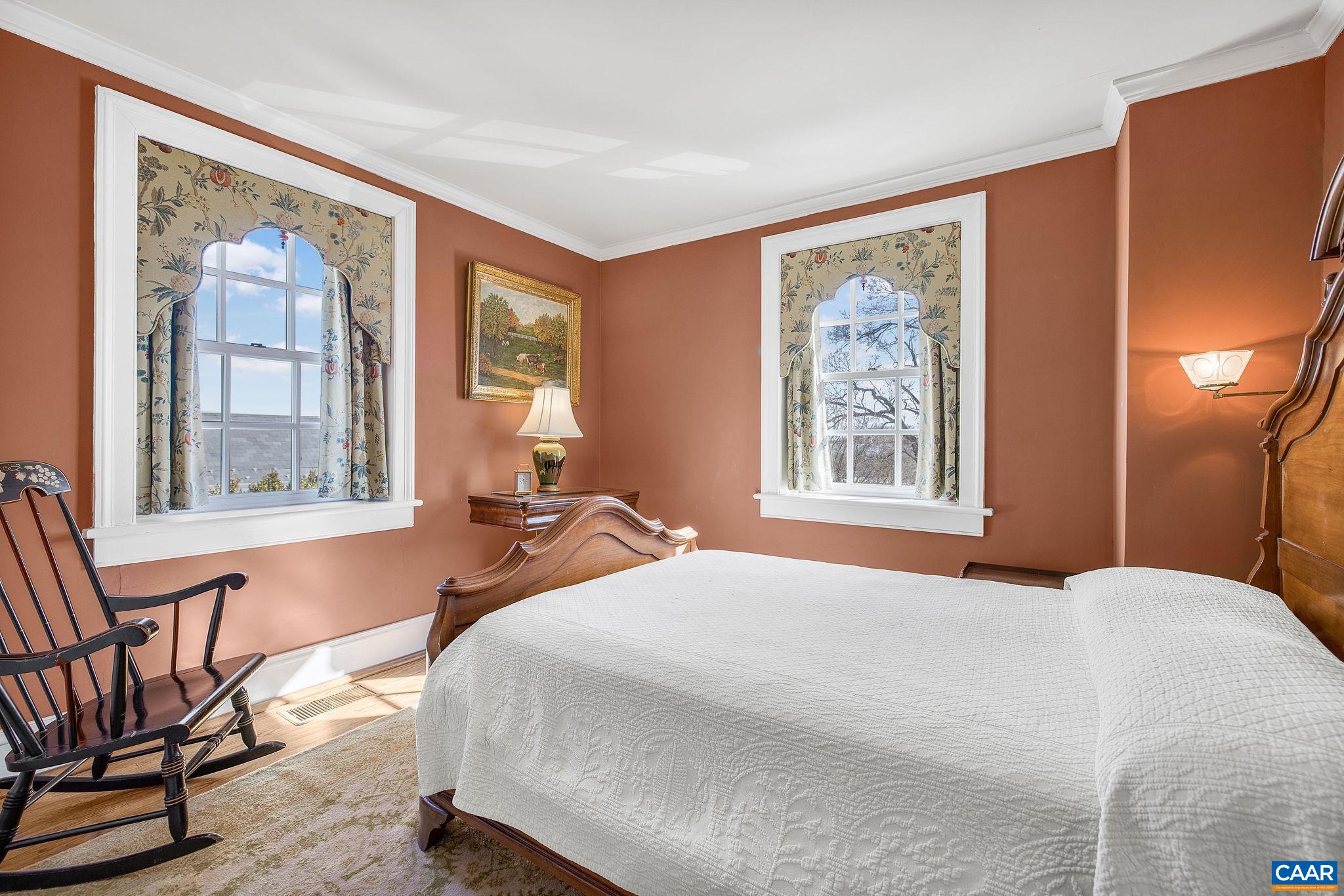 2328 Liberty Corner Road Esmont, VA 22937 - Photo 33 of 75 a bedroom with a bed and wooden floor