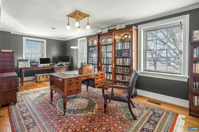 aerial view of a house with a garden and lake view