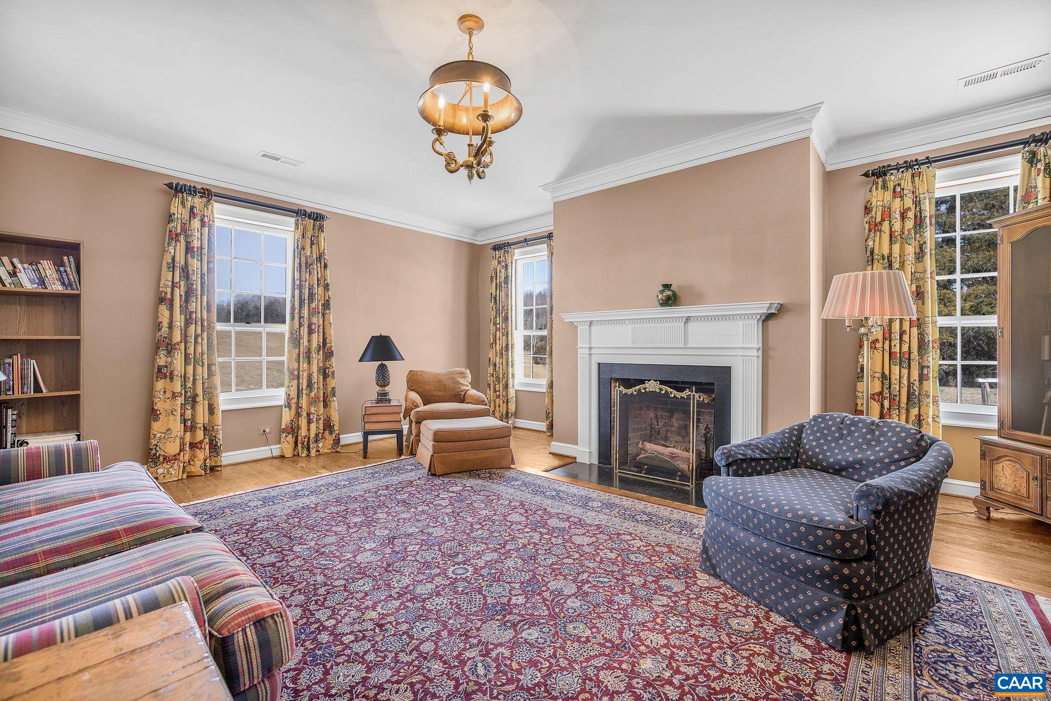 2328 Liberty Corner Road Esmont, VA 22937 - Photo 40 of 75 a living room with furniture a window and a fireplace