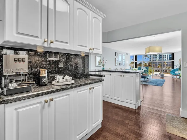 a living room with fireplace furniture and a wooden floor
