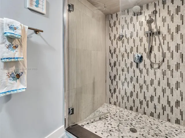 a view of a terrace with chairs and a potted plant
