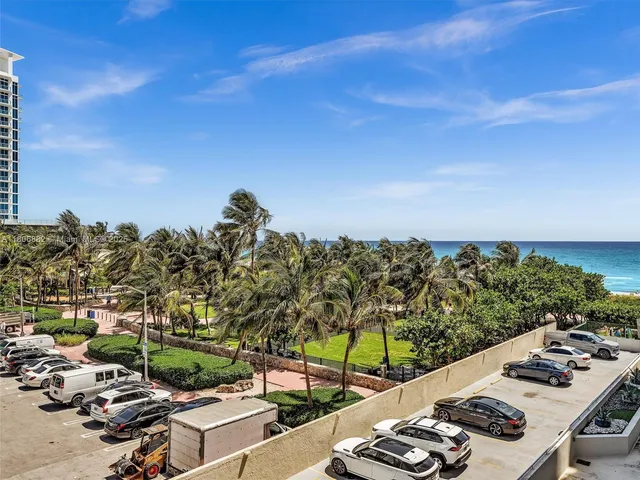a bathroom with a tub a double vanity sink and mirror