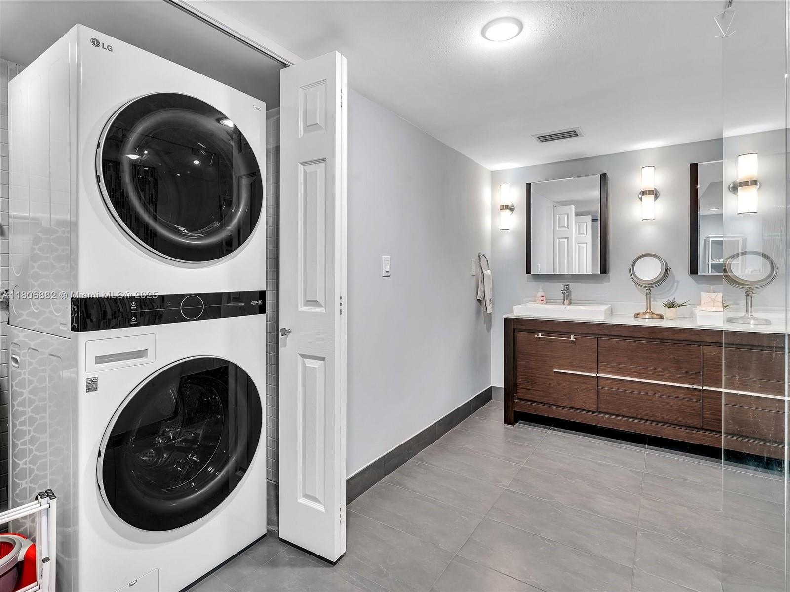 6423 Collins Avenue, Unit 409 Miami Beach, FL 33141 - Photo 42 of 66 a utility room with dryer and washer
