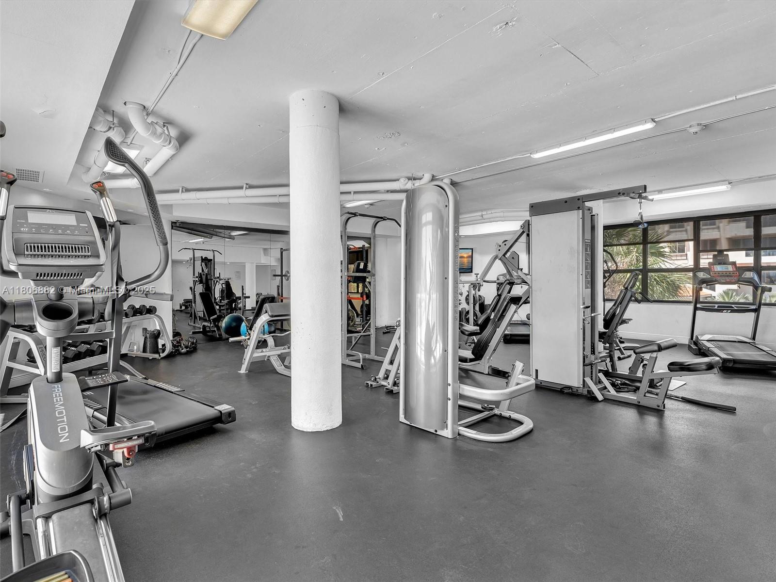 6423 Collins Avenue, Unit 409 Miami Beach, FL 33141 - Photo 47 of 66 a view of a room with gym equipment