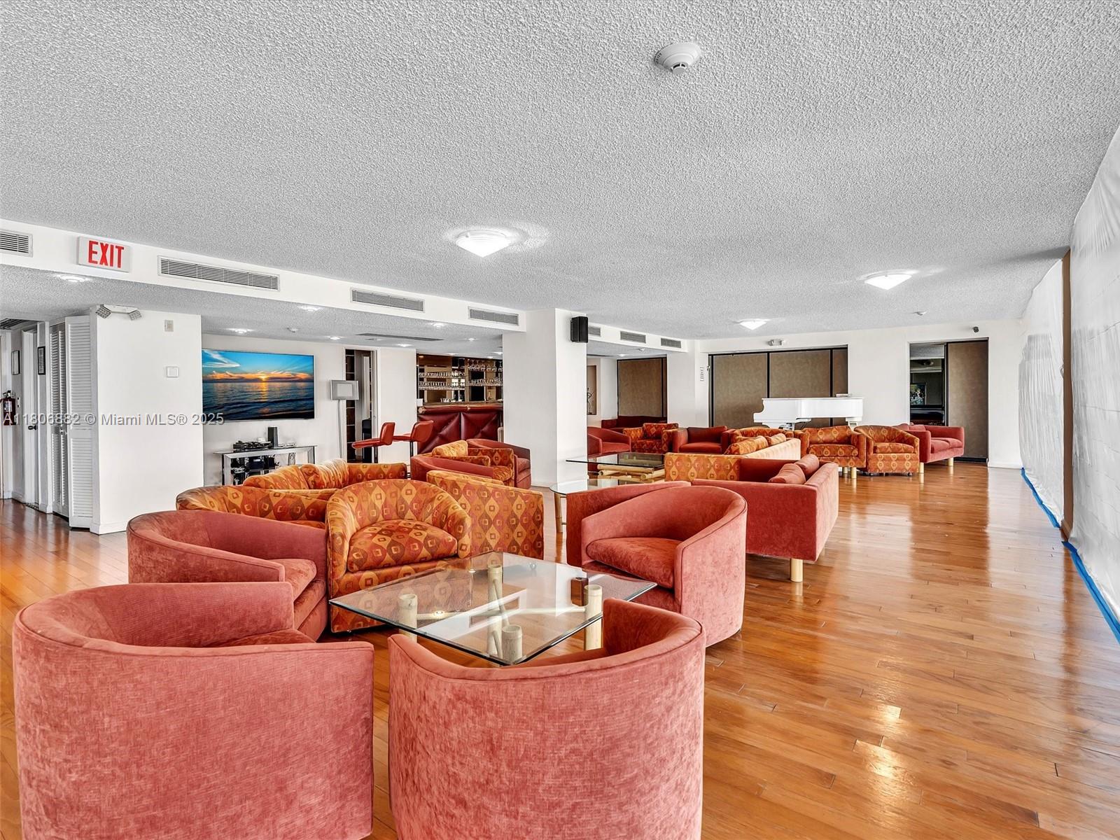 6423 Collins Avenue, Unit 409 Miami Beach, FL 33141 - Photo 50 of 66 a living room with furniture kitchen view and a large window