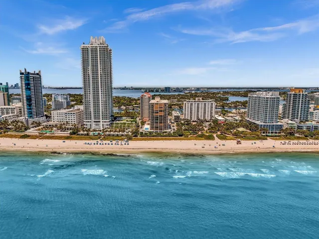 a view of a lake with tall buildings