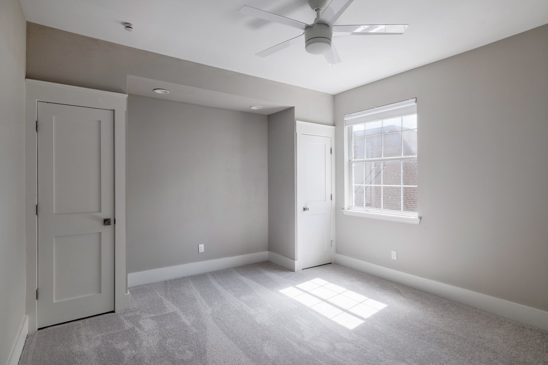 5512 Ballenton Lane Austin, TX 78739 - Photo 34 of 40 A well-lit bedroom with soft carpeting awaits your personal touch.