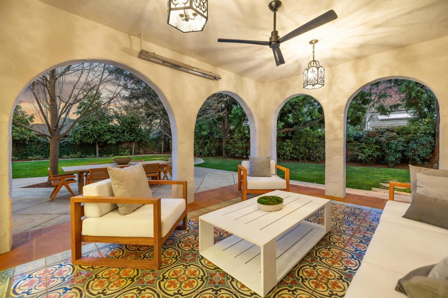 414 Edgewood Road San Mateo, CA 94402 - Photo 107 of 112 a view of a patio with couches table and chairs with wooden floor and fence