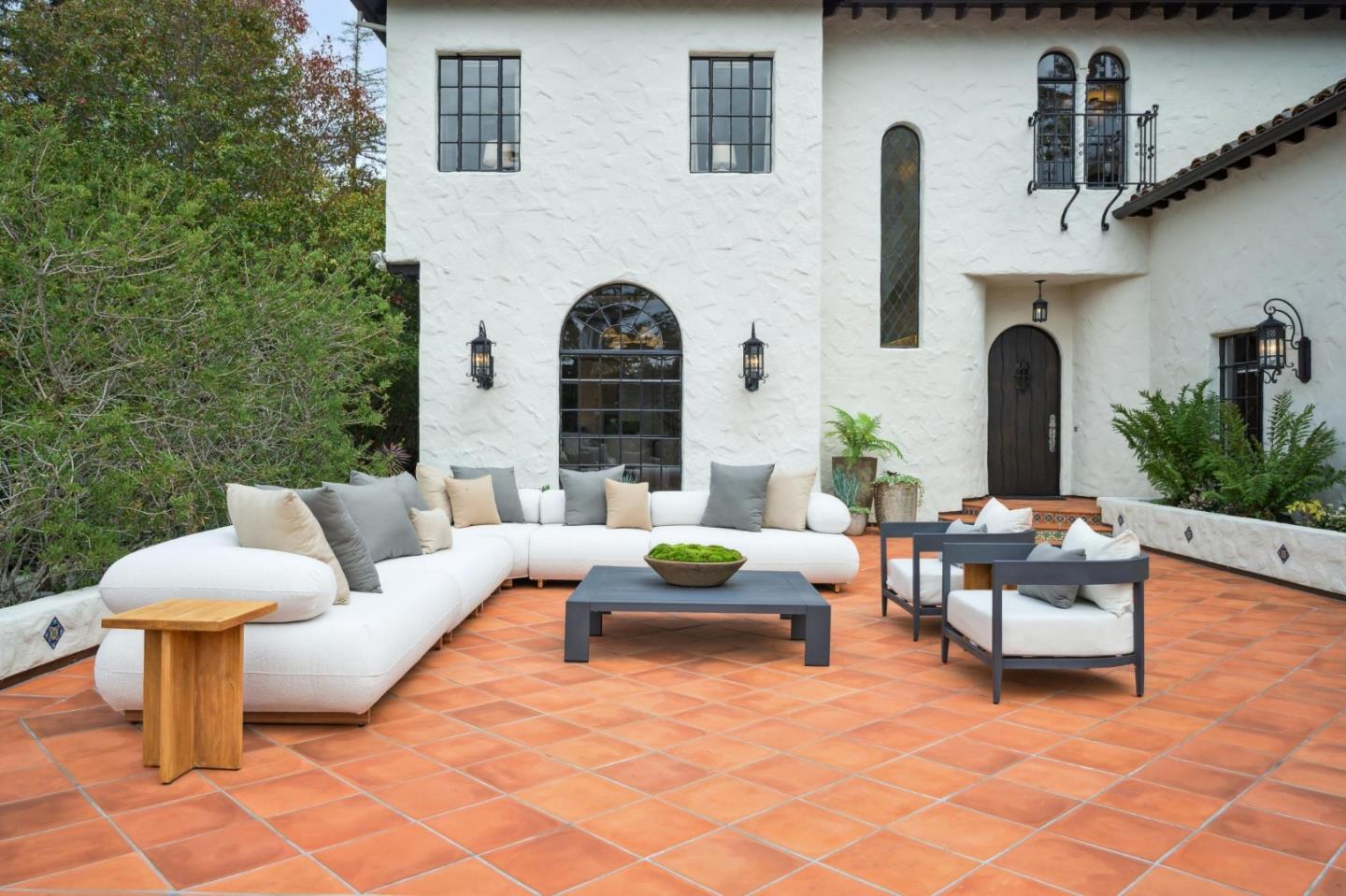 414 Edgewood Road San Mateo, CA 94402 - Photo 11 of 112 a view of a patio with couches table and chairs with potted plants