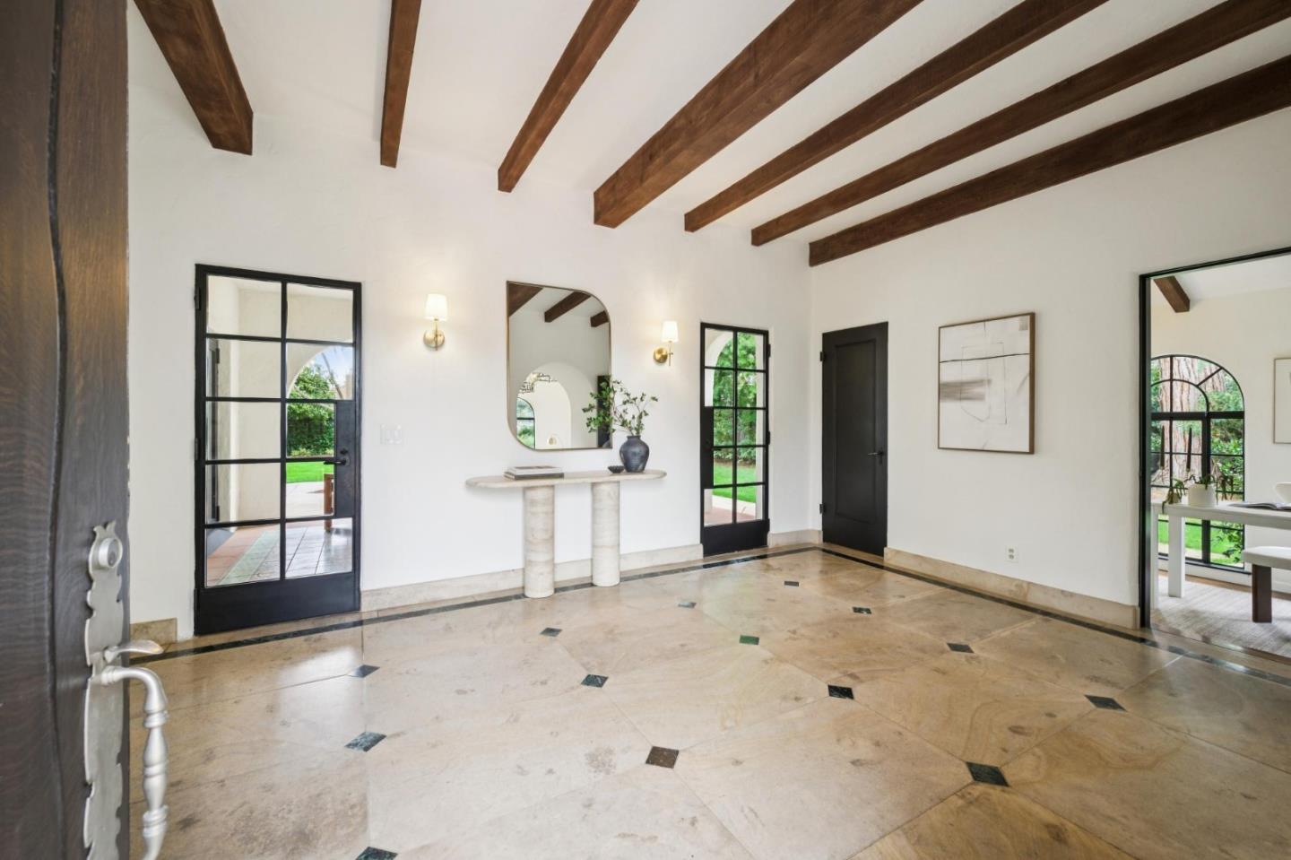 414 Edgewood Road San Mateo, CA 94402 - Photo 15 of 112 a view of a livingroom with wooden floor and a ceiling fan