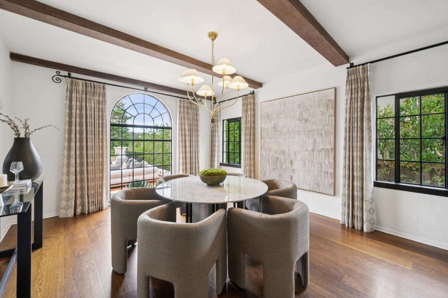 414 Edgewood Road San Mateo, CA 94402 - Photo 27 of 112 a dining room with furniture a chandelier and wooden floor