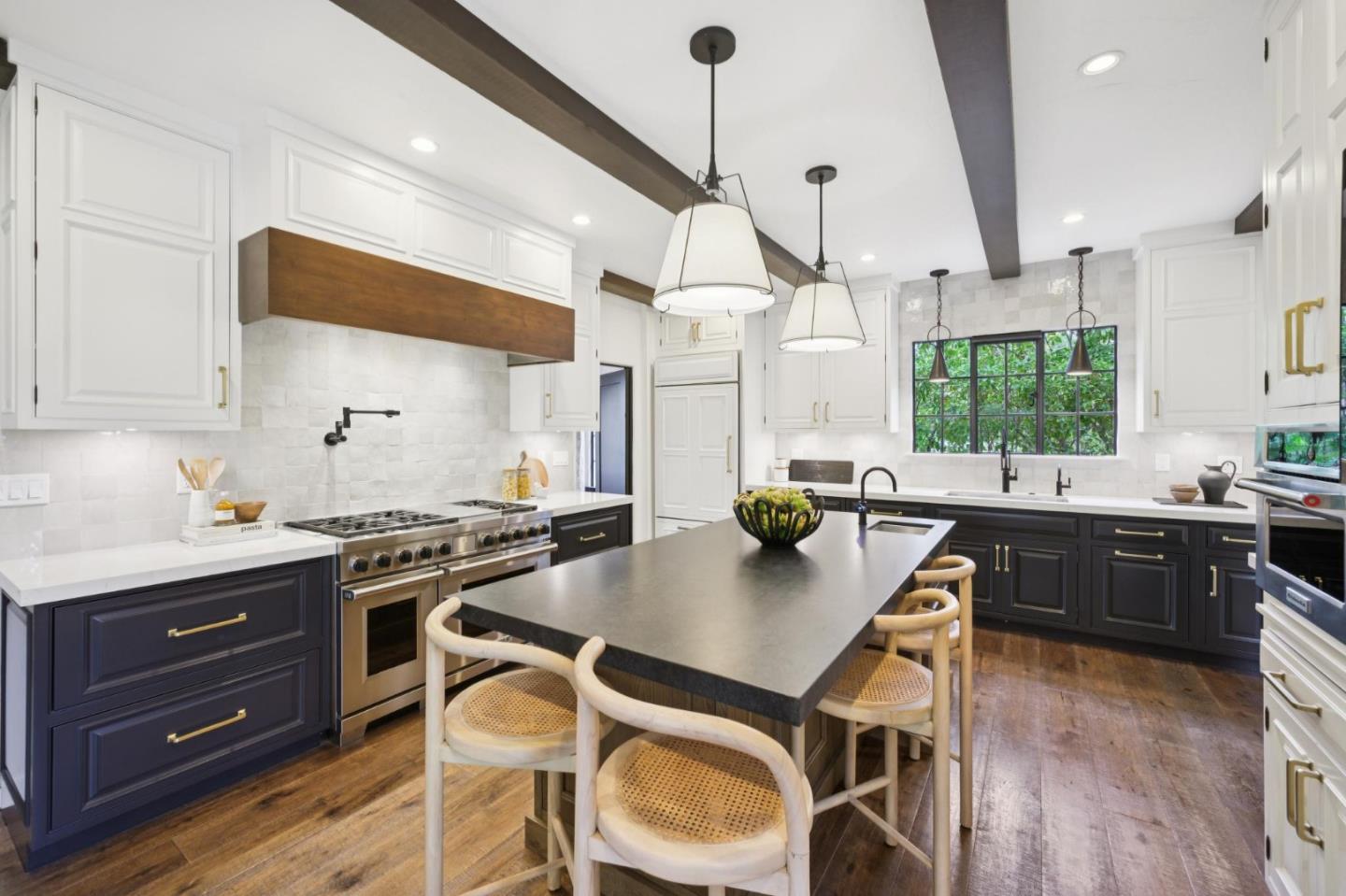 414 Edgewood Road San Mateo, CA 94402 - Photo 34 of 112 a kitchen with stainless steel appliances granite countertop a stove a sink dishwasher a refrigerator and a dining table with wooden floor