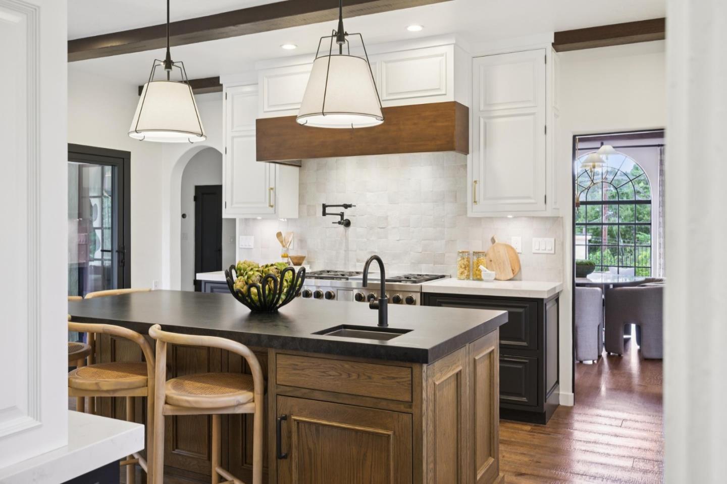 414 Edgewood Road San Mateo, CA 94402 - Photo 36 of 112 a kitchen with stainless steel appliances granite countertop a sink a stove and a wooden floors