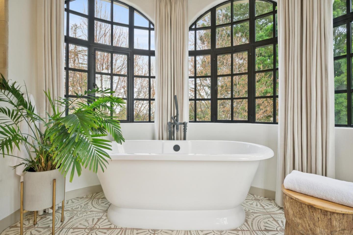 414 Edgewood Road San Mateo, CA 94402 - Photo 55 of 112 a white bath tub sitting in a bathroom next to a window