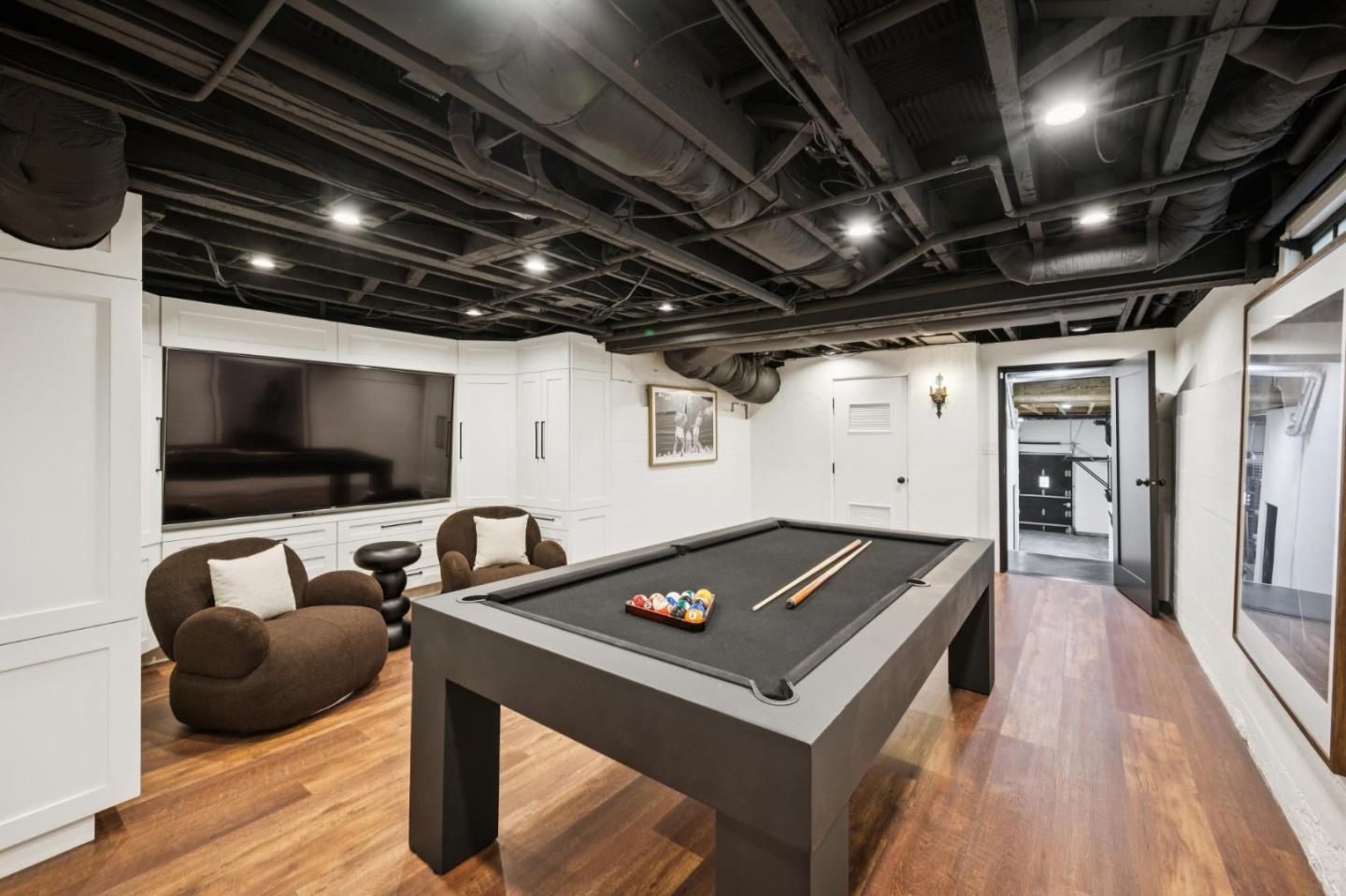 414 Edgewood Road San Mateo, CA 94402 - Photo 69 of 112 a living room with furniture and a flat screen tv