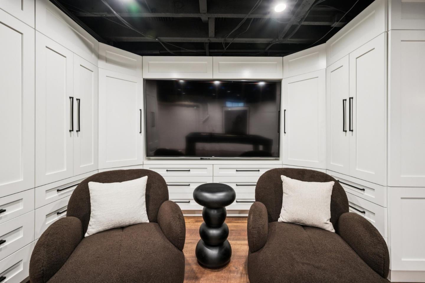 414 Edgewood Road San Mateo, CA 94402 - Photo 70 of 112 a living room with furniture and a flat screen tv