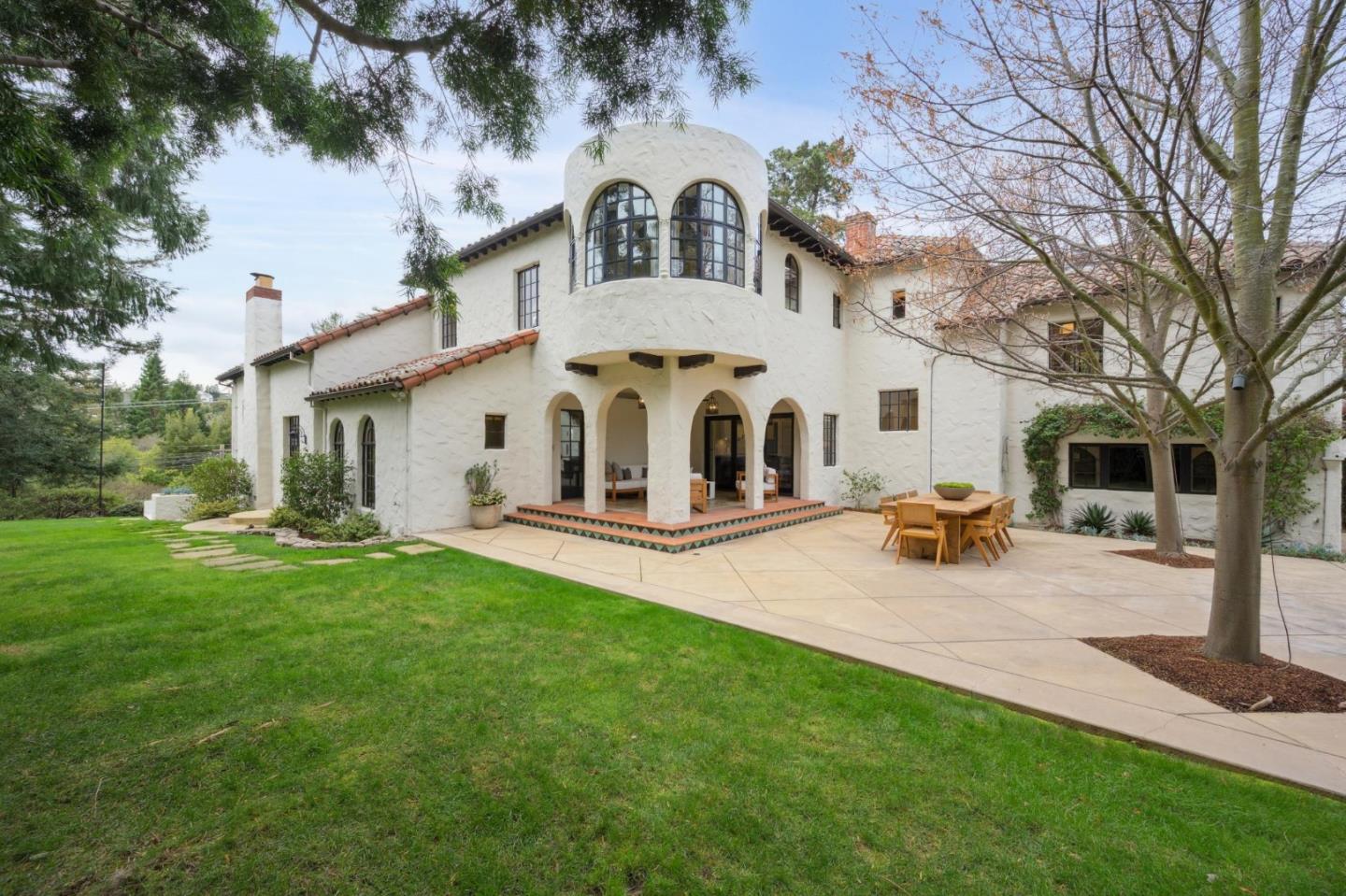 414 Edgewood Road San Mateo, CA 94402 - Photo 73 of 112 a view of a white house with a big yard and large trees