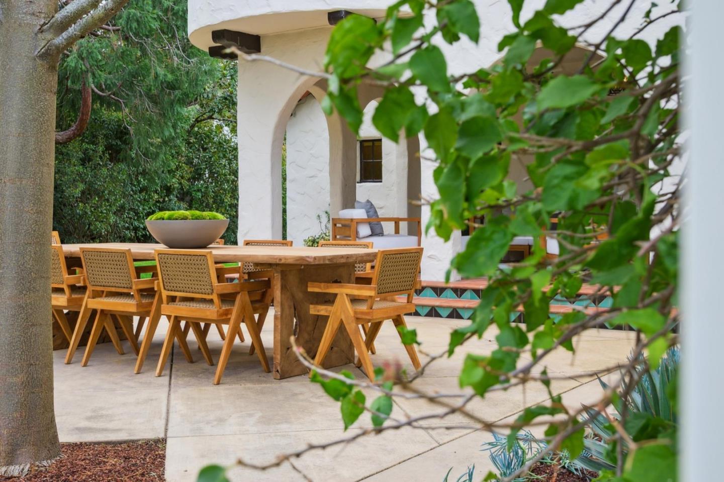 414 Edgewood Road San Mateo, CA 94402 - Photo 77 of 112 a view of a patio with table and chairs and potted plants