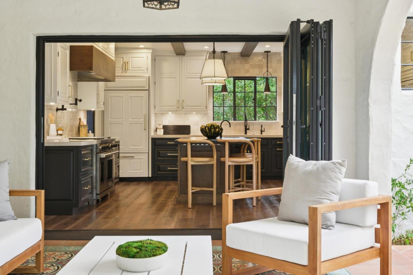 414 Edgewood Road San Mateo, CA 94402 - Photo 83 of 112 a living room with furniture a large window and kitchen view