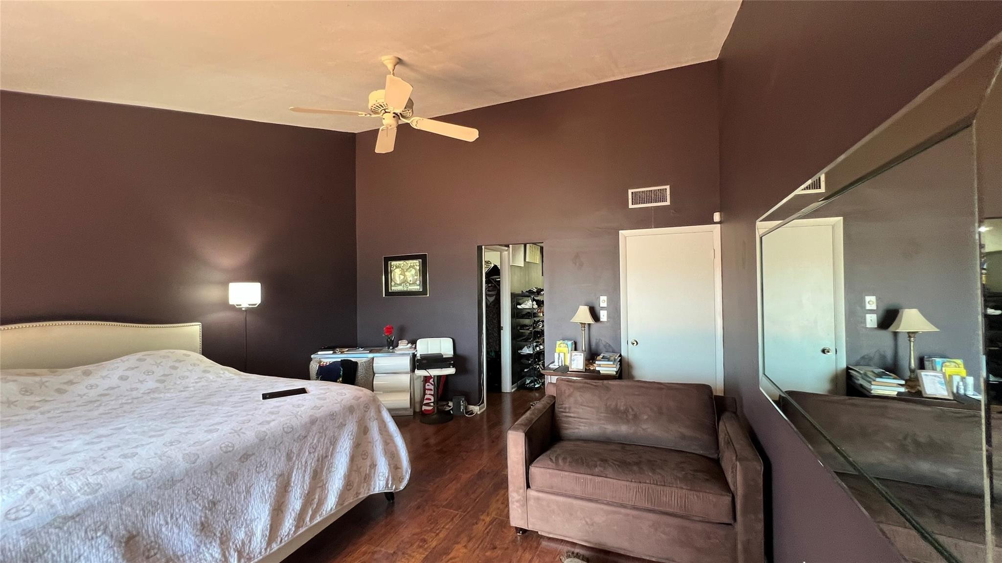 Undisclosed Address Miami, FL 33179 - Photo 15 of 15 a bedroom with a large bed and a chandelier