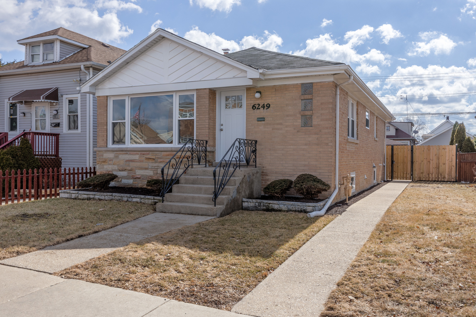6249 West Addison Street Chicago, IL 60634 - Photo 2 of 35 a front view of a house with garden