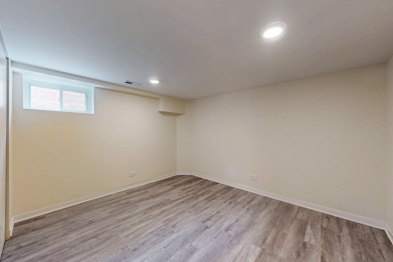 6249 West Addison Street Chicago, IL 60634 - Photo 25 of 35 a view of empty room with wooden floor