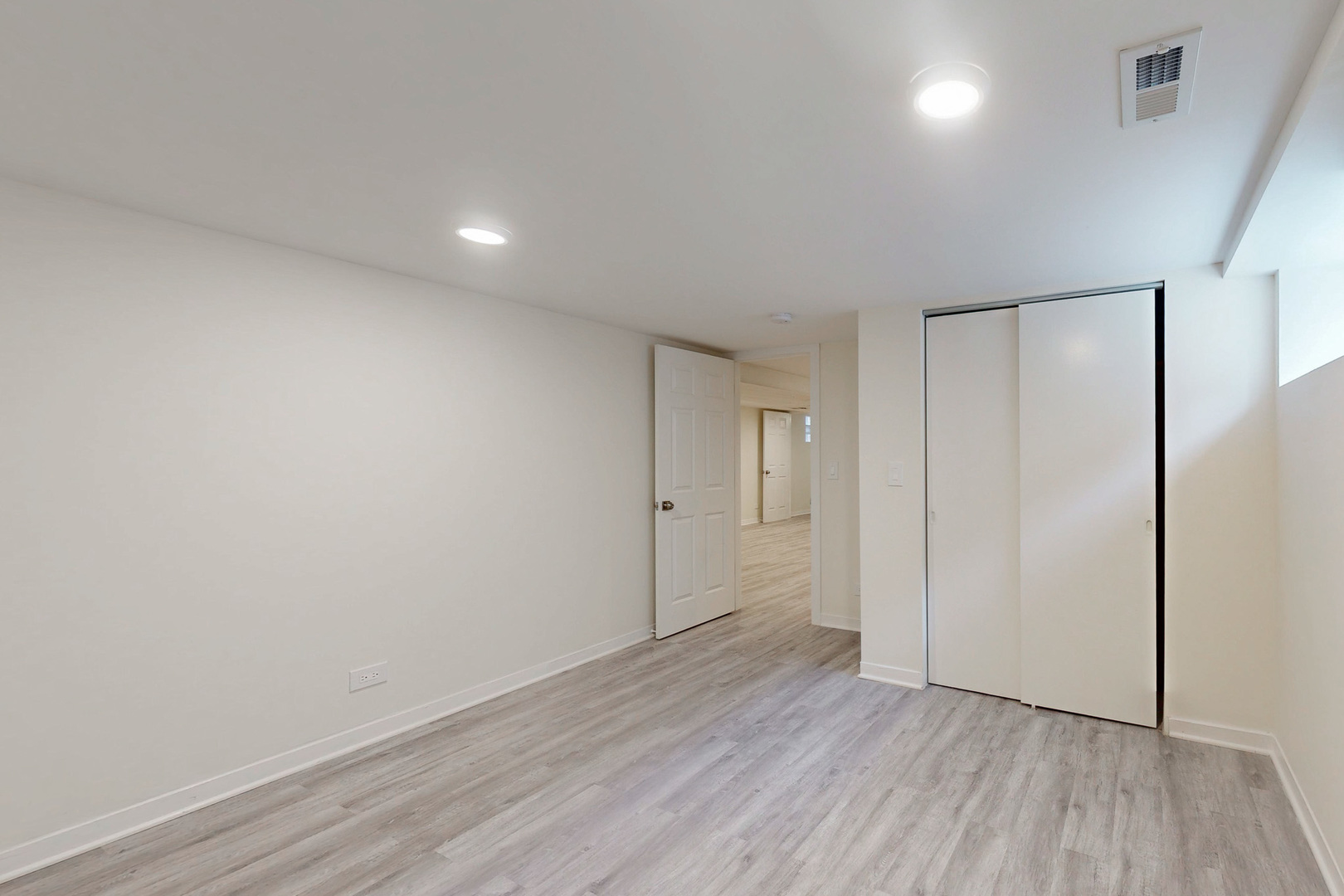 6249 West Addison Street Chicago, IL 60634 - Photo 27 of 35 a view of an empty room with wooden floor