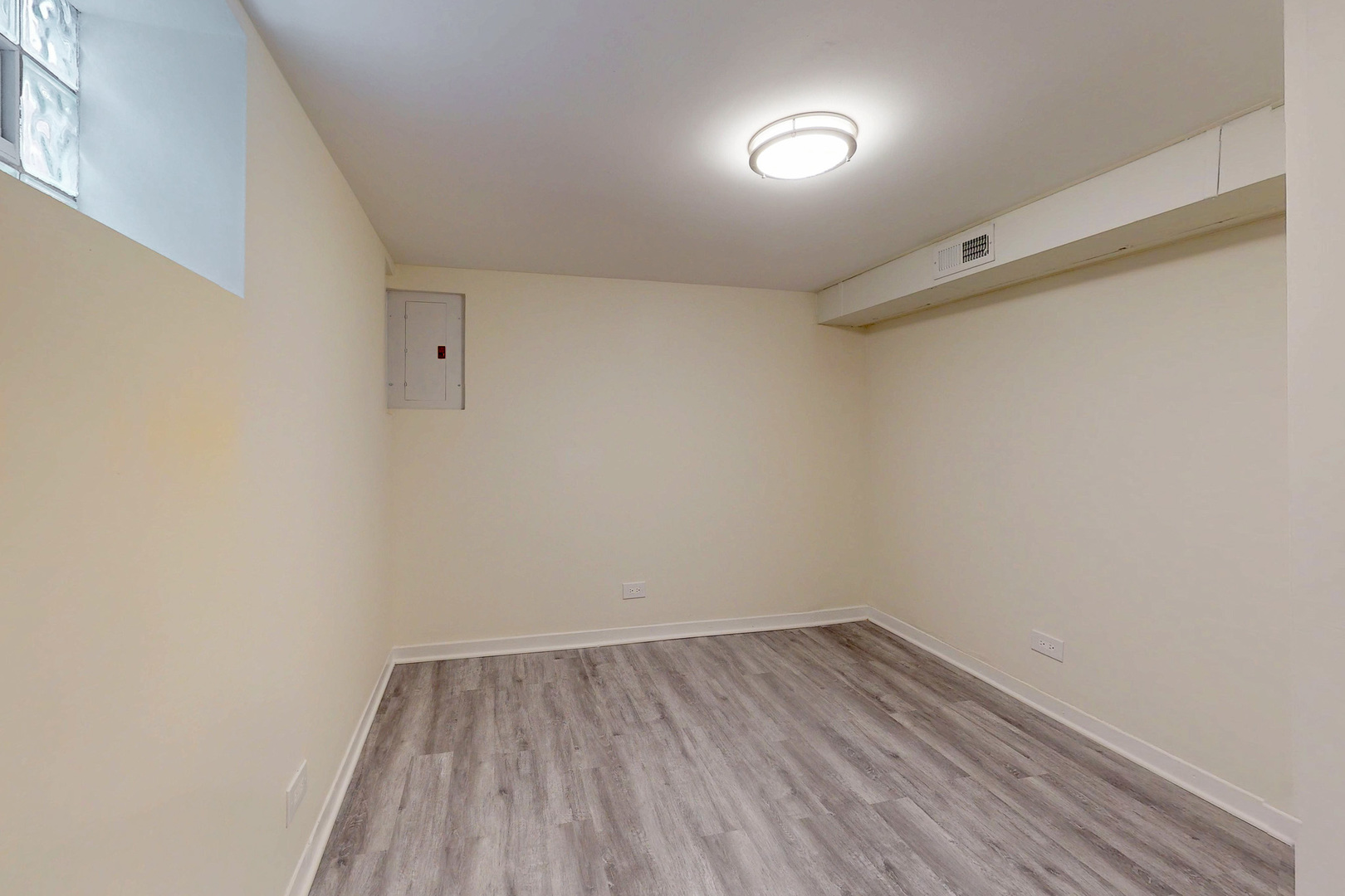 6249 West Addison Street Chicago, IL 60634 - Photo 30 of 35 a view of an empty room with wooden floor