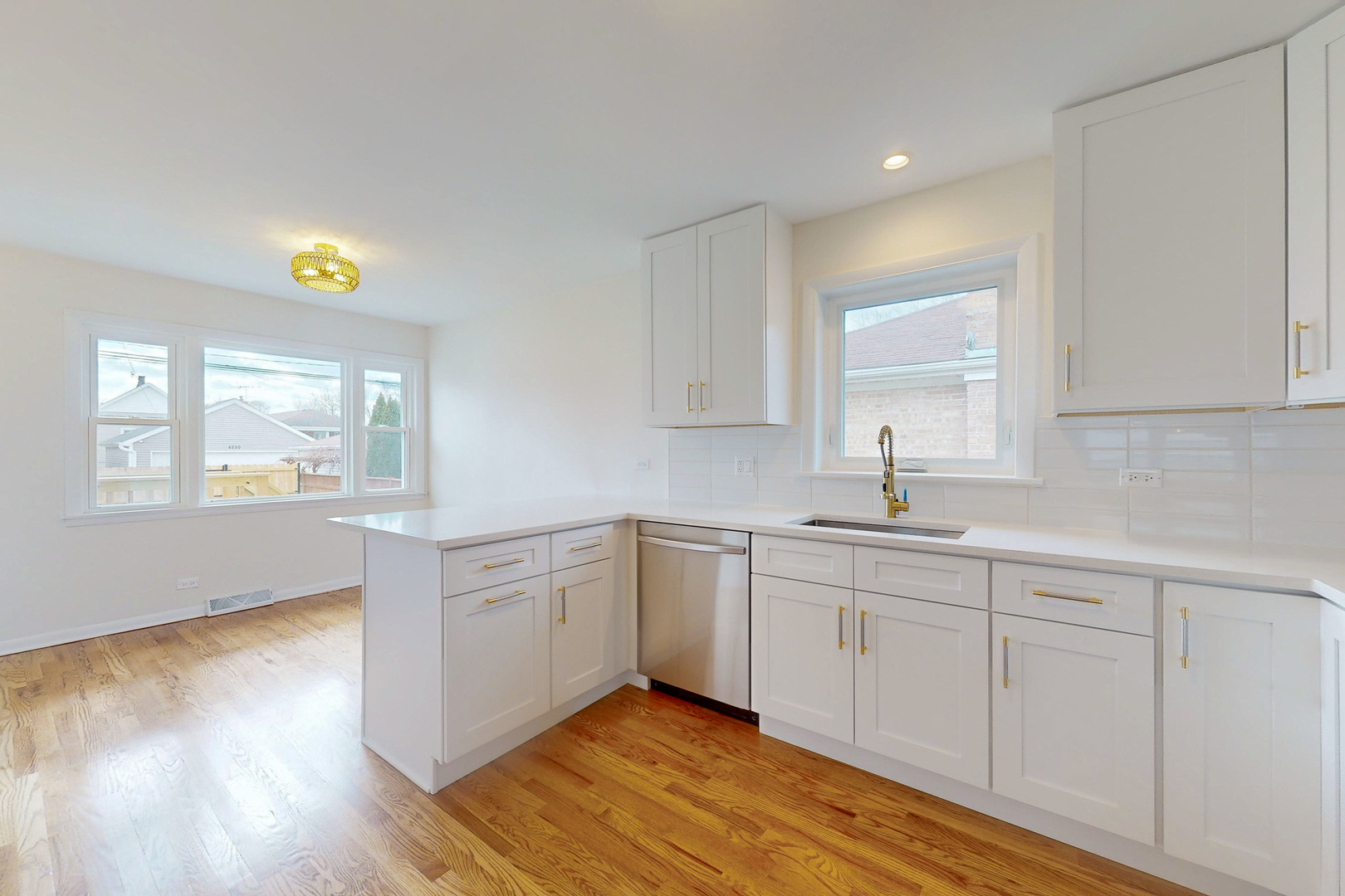6249 West Addison Street Chicago, IL 60634 - Photo 4 of 35 a kitchen with appliances cabinets and a wooden floor