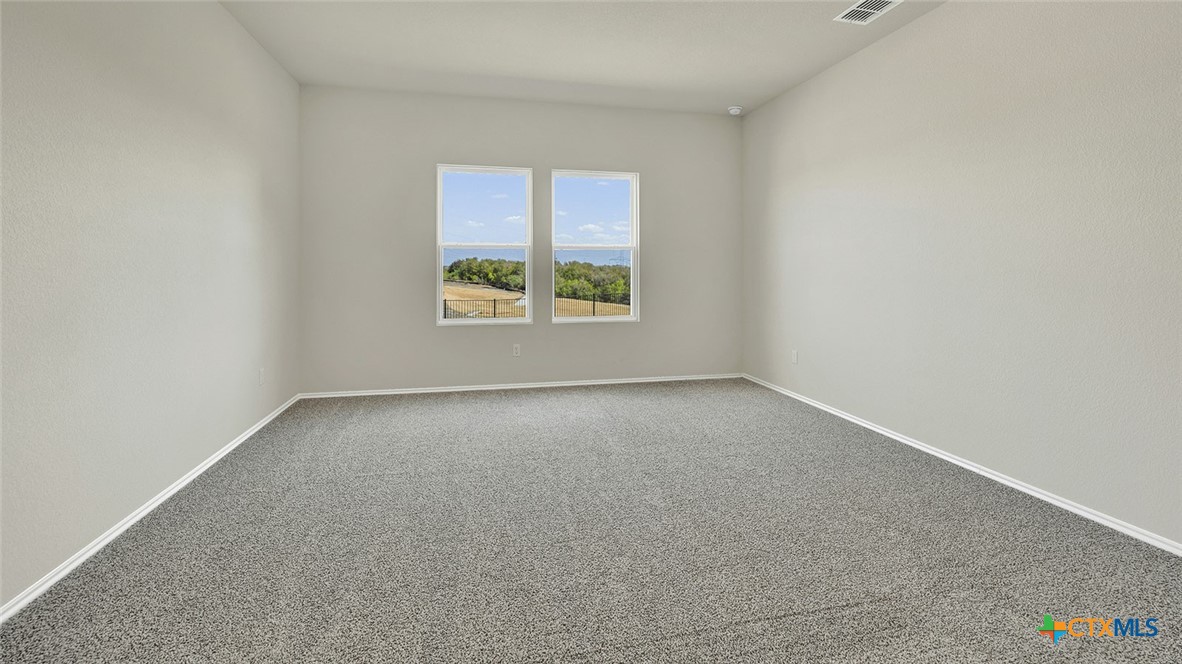 521 Hodges Street Lockhart, TX 78644 - Photo 21 of 40 an empty room with a window
