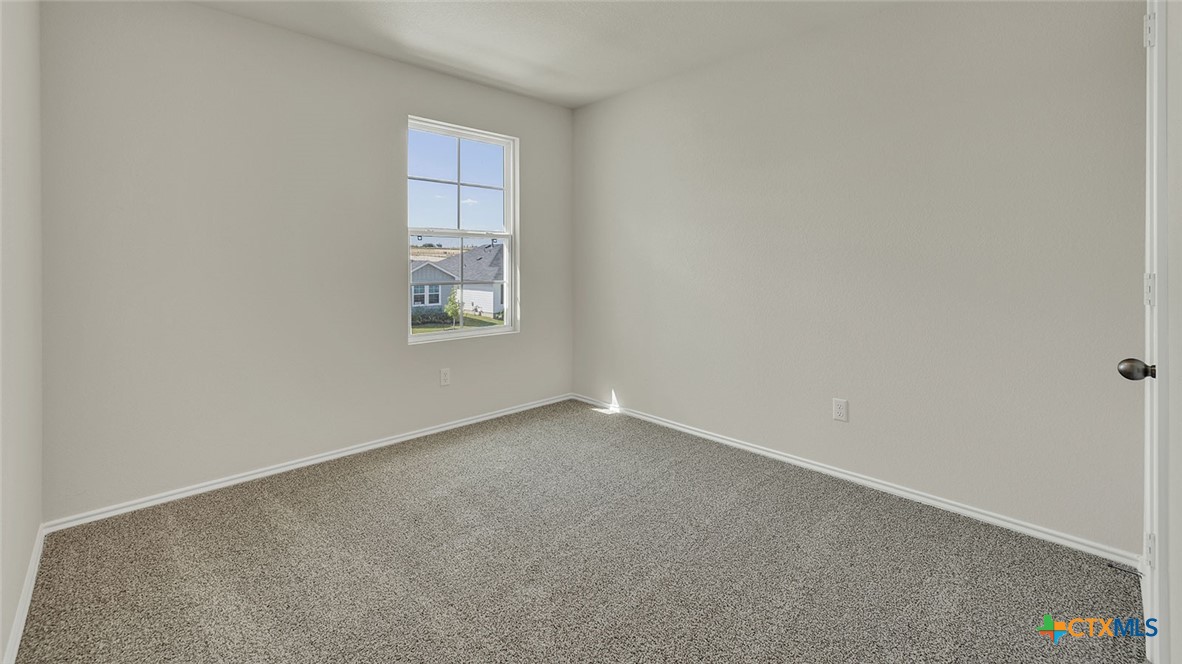 521 Hodges Street Lockhart, TX 78644 - Photo 32 of 40 an empty room with a window