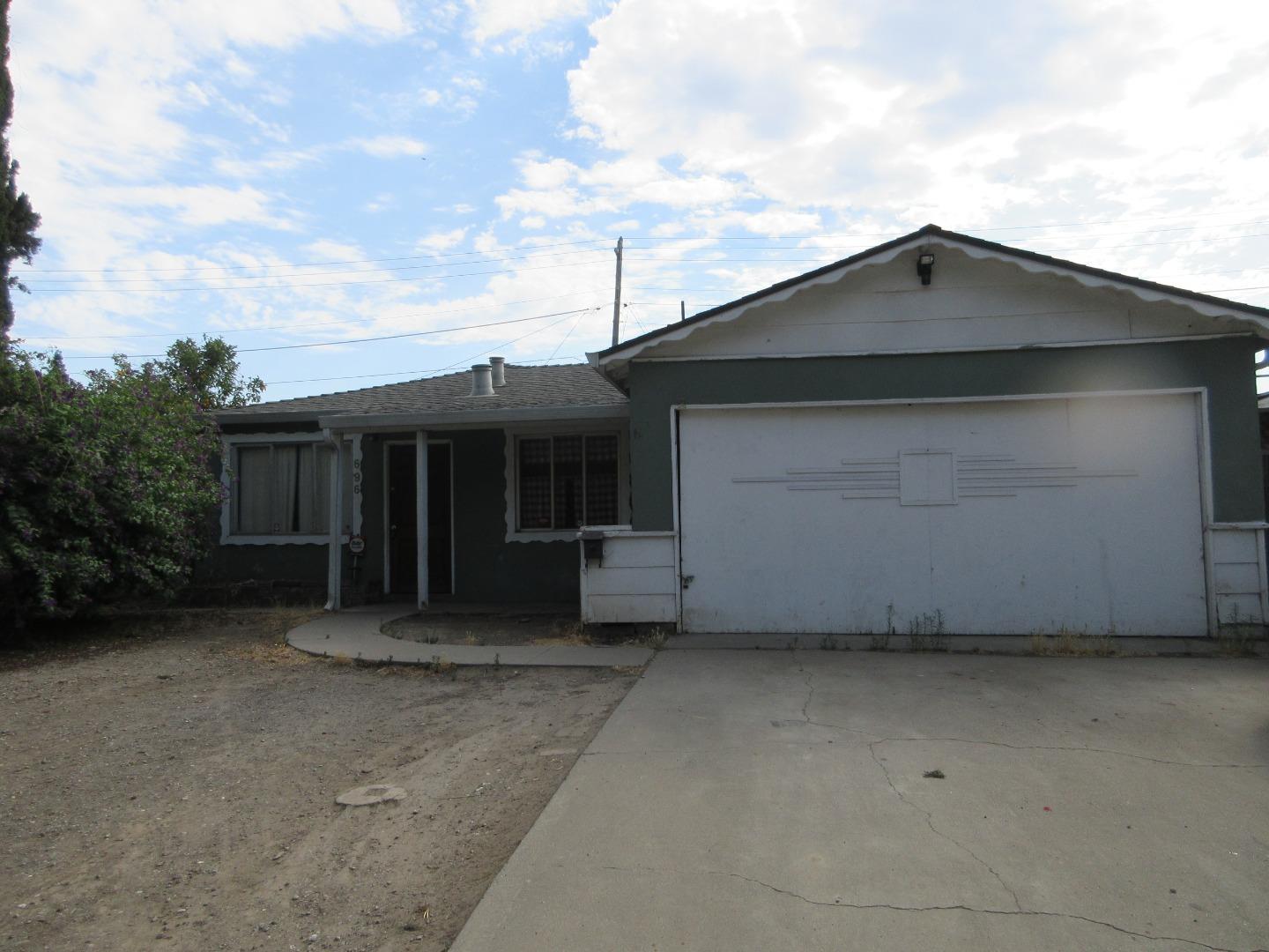 696 Coyote Road San Jose, CA 95111 - Photo 1 of 18 a front view of a house with a garden