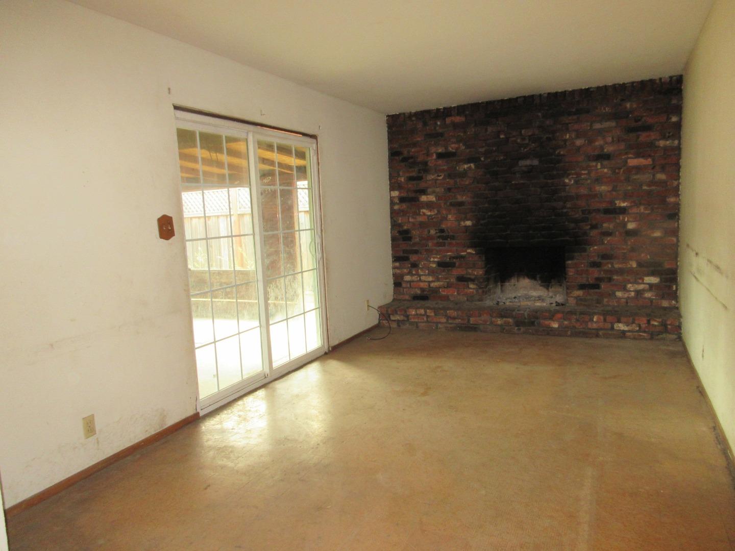 696 Coyote Road San Jose, CA 95111 - Photo 4 of 18 a view of an empty room with a fireplace