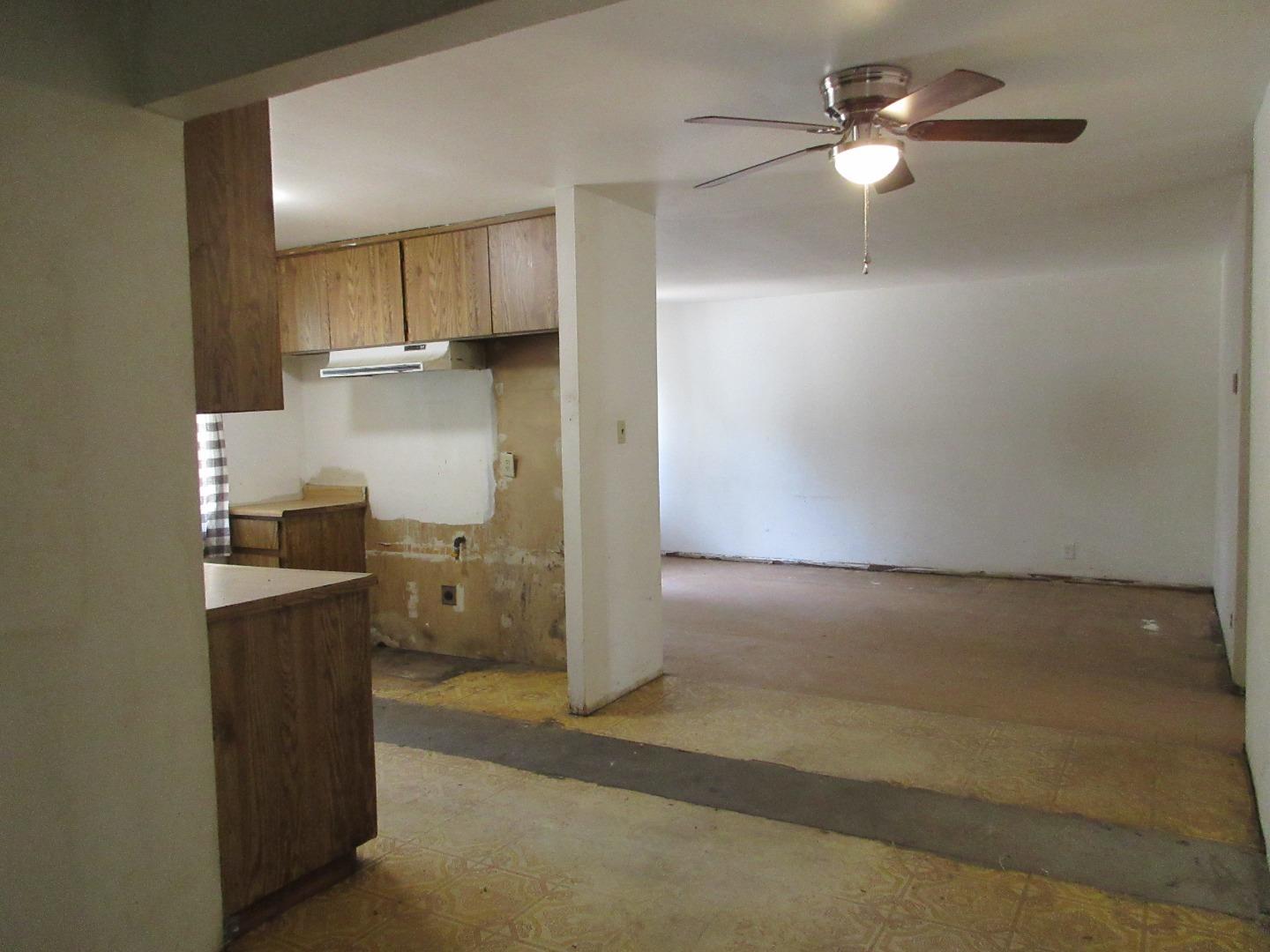 696 Coyote Road San Jose, CA 95111 - Photo 6 of 18 a kitchen with a refrigerator and a stove top oven
