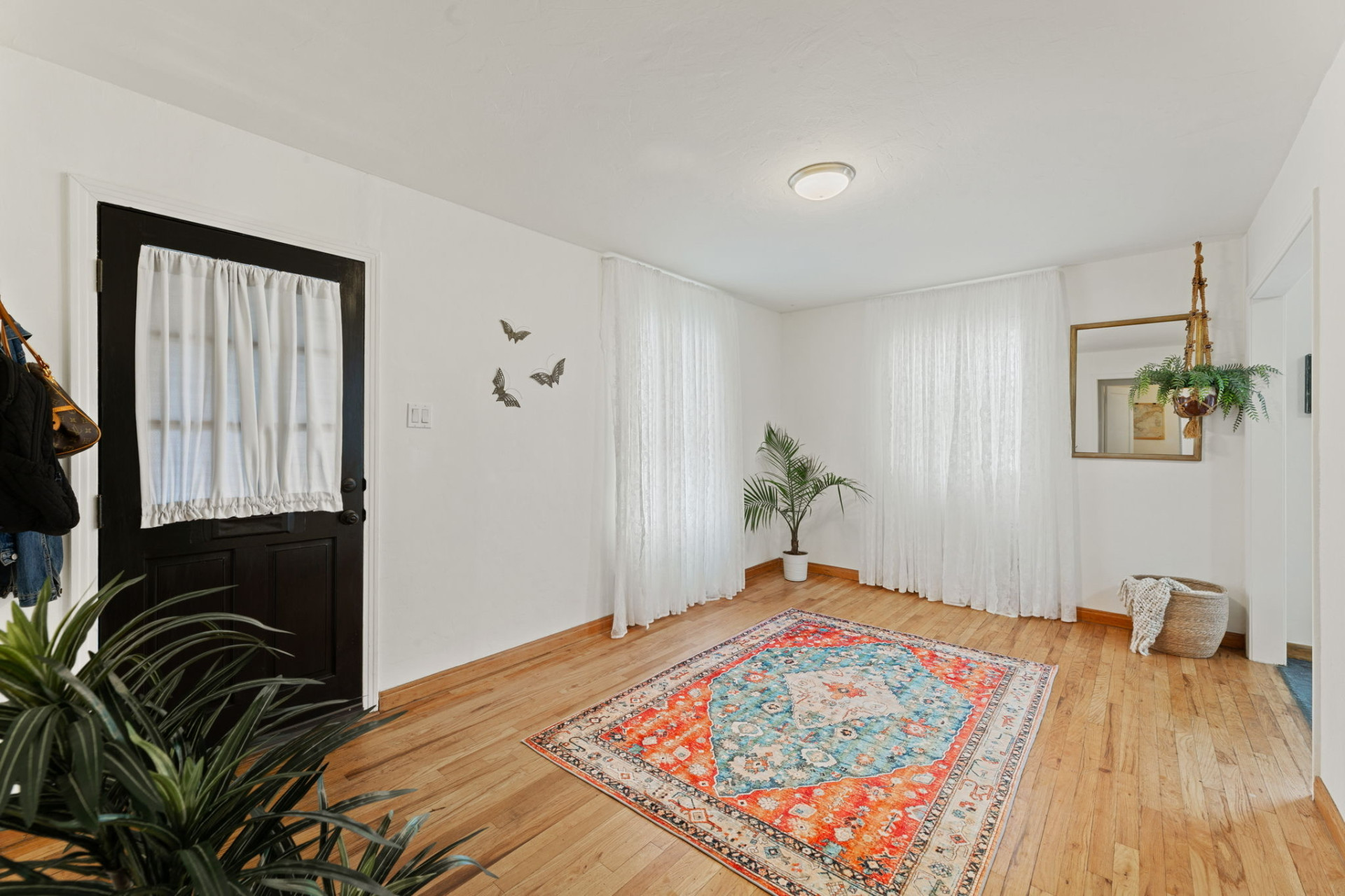 1303 Walnut Avenue Austin, TX 78702 - Photo 3 of 12 a bedroom with a bed and a painting on the wall