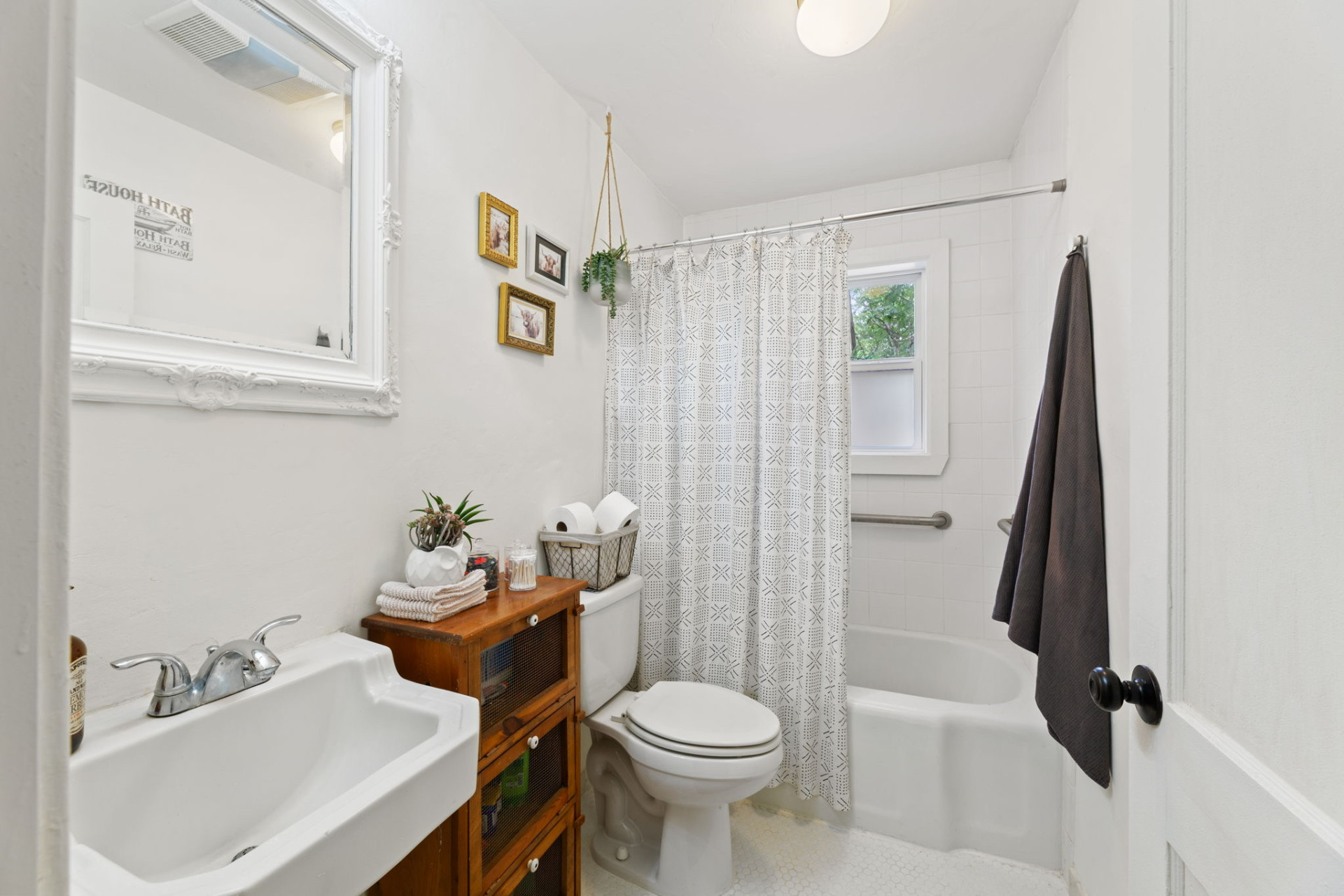 1303 Walnut Avenue Austin, TX 78702 - Photo 6 of 12 a bathroom with a sink toilet and shower