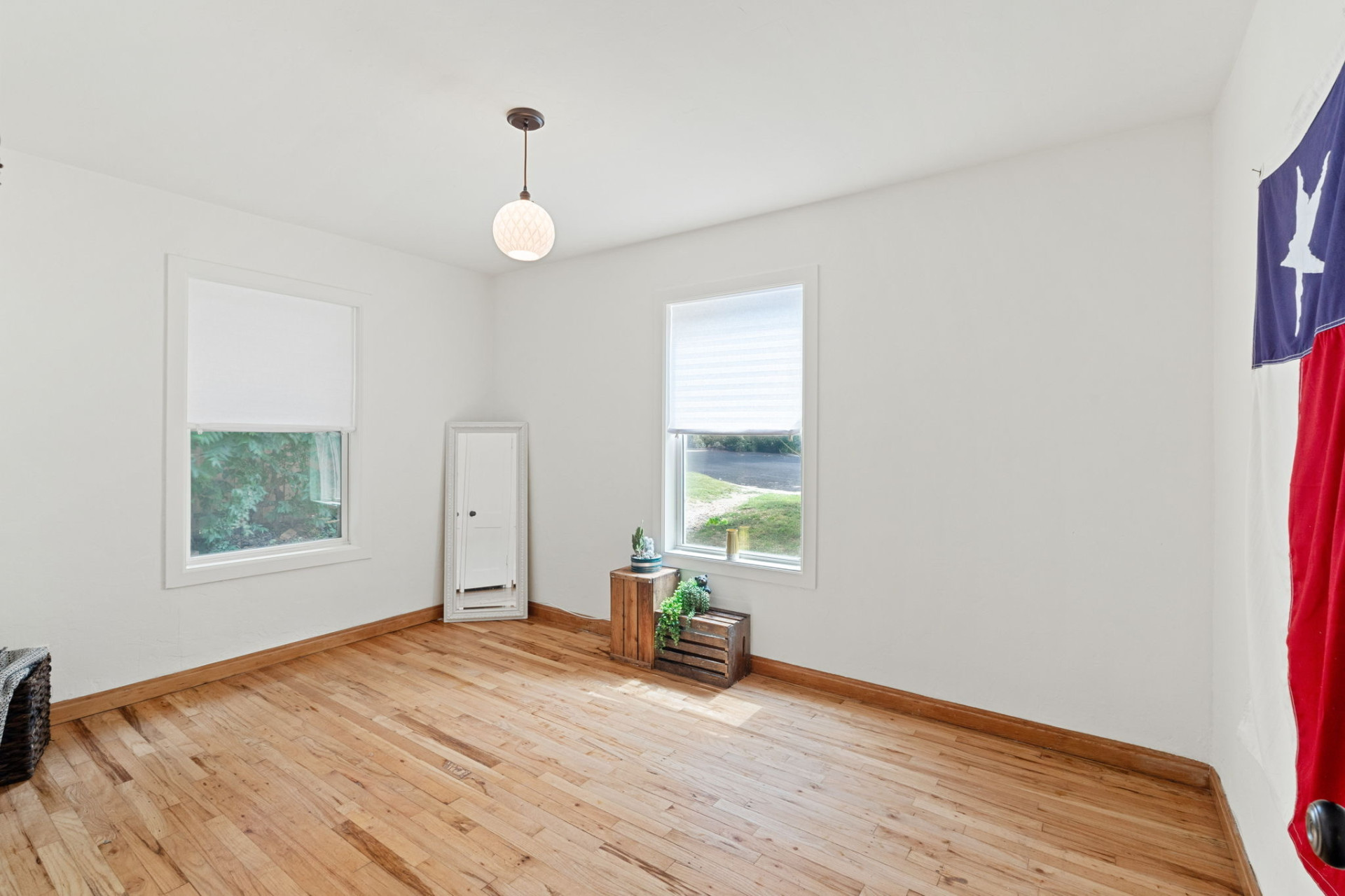 1303 Walnut Avenue Austin, TX 78702 - Photo 7 of 12 a view of empty room with wooden floor and fan