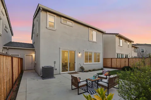 a backyard of a house with seating space