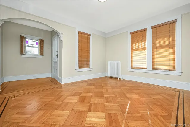 a view of an empty room with a window