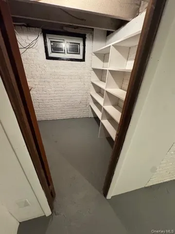 a view of a field of grass and trees