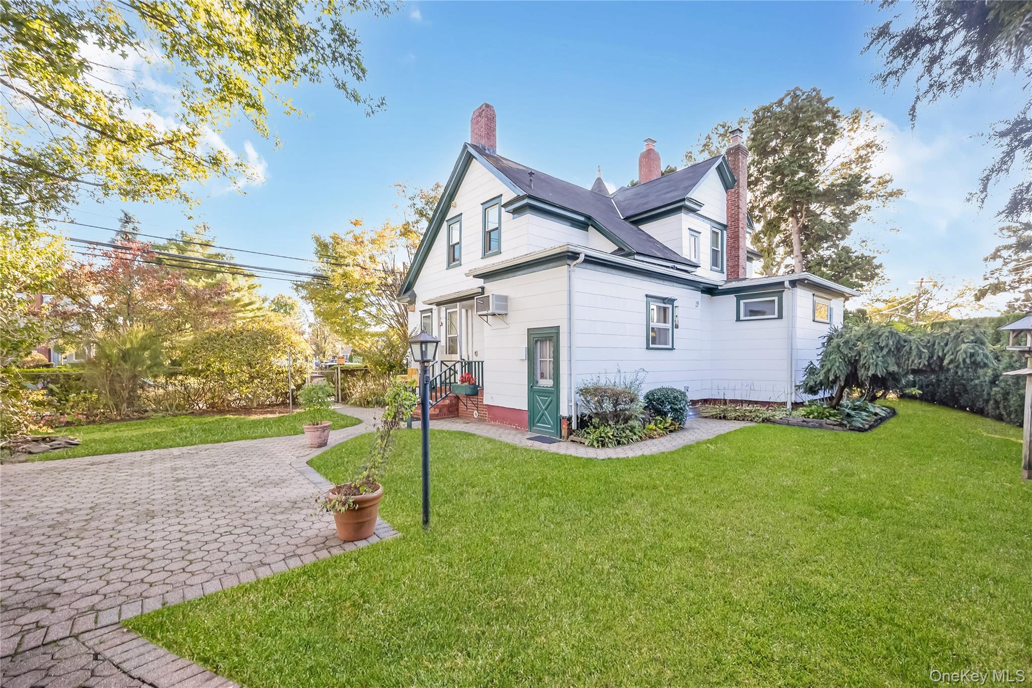 215 Conklin Street Farmingdale, NY 11735 - Photo 4 of 50 a view of a house with backyard and a tree