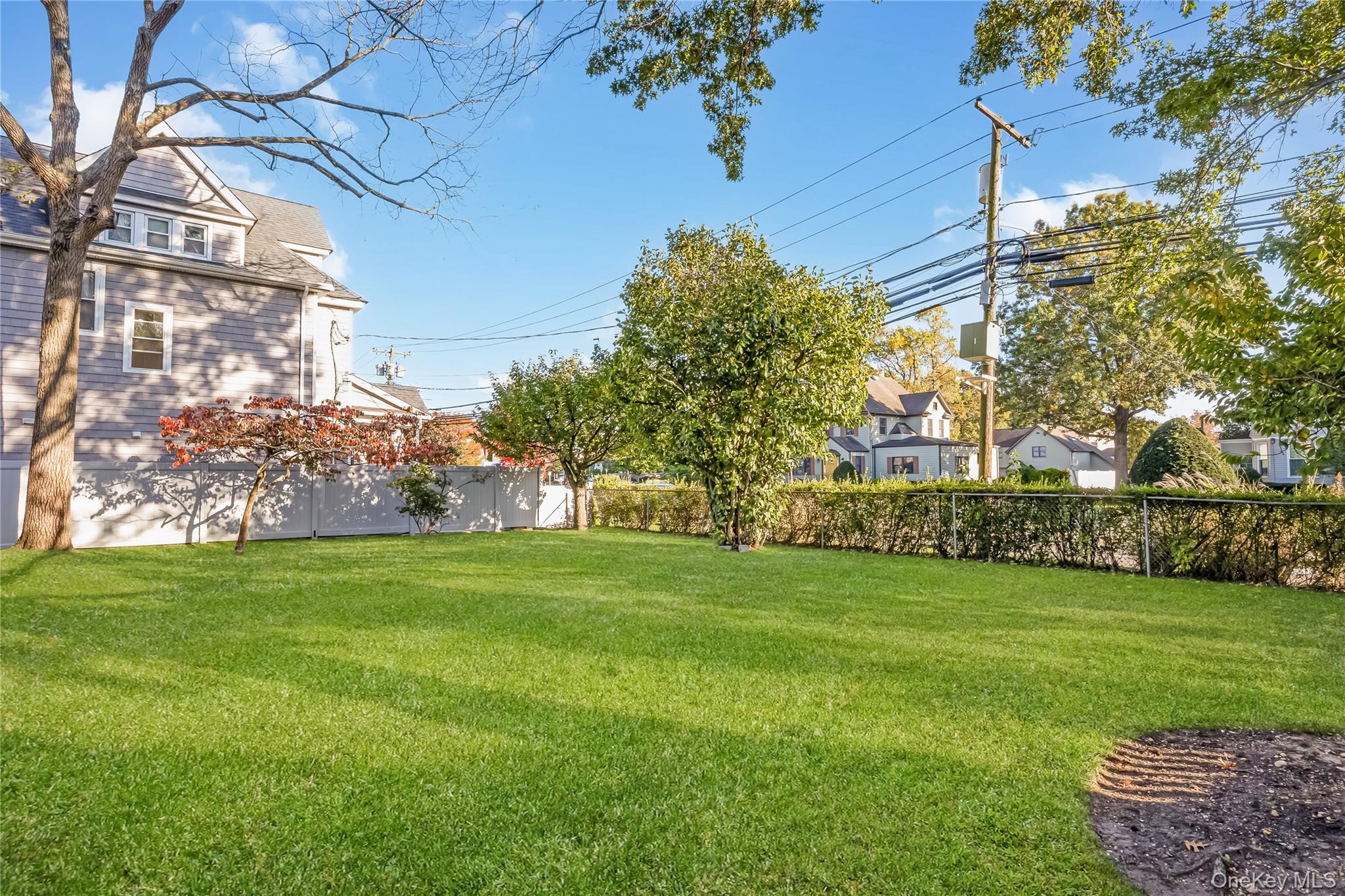 215 Conklin Street Farmingdale, NY 11735 - Photo 41 of 50 a view of a field of grass and trees