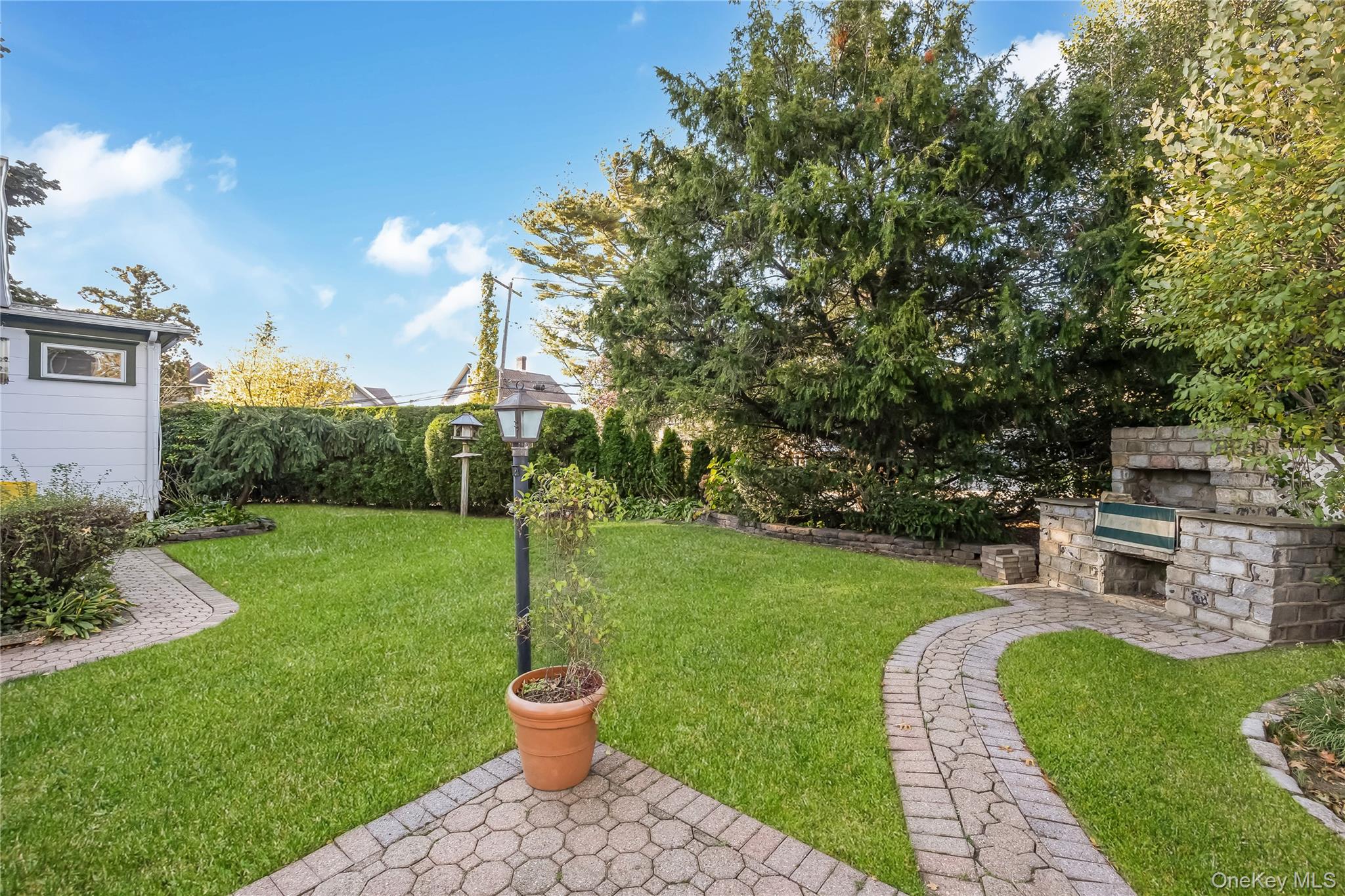 215 Conklin Street Farmingdale, NY 11735 - Photo 43 of 50 a view of a garden with a house