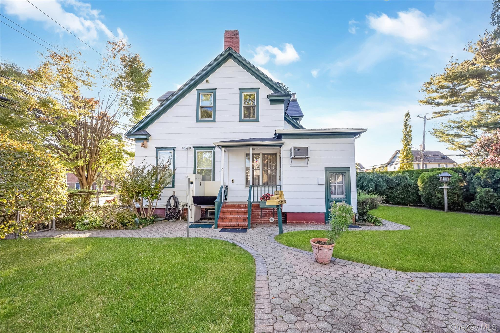215 Conklin Street Farmingdale, NY 11735 - Photo 5 of 50 a front view of a house with garden and porch